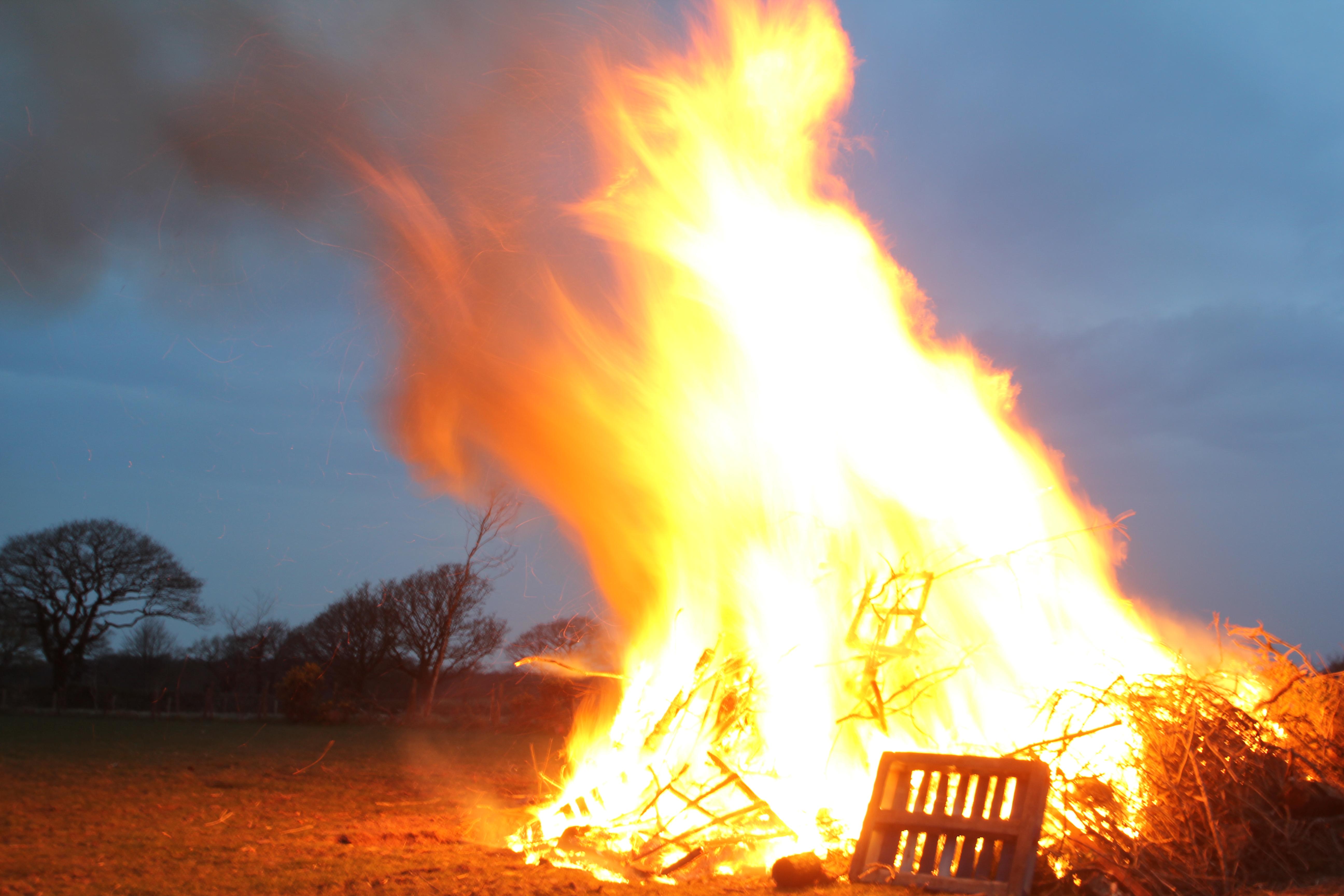 large bonfire including burning palettes and branches